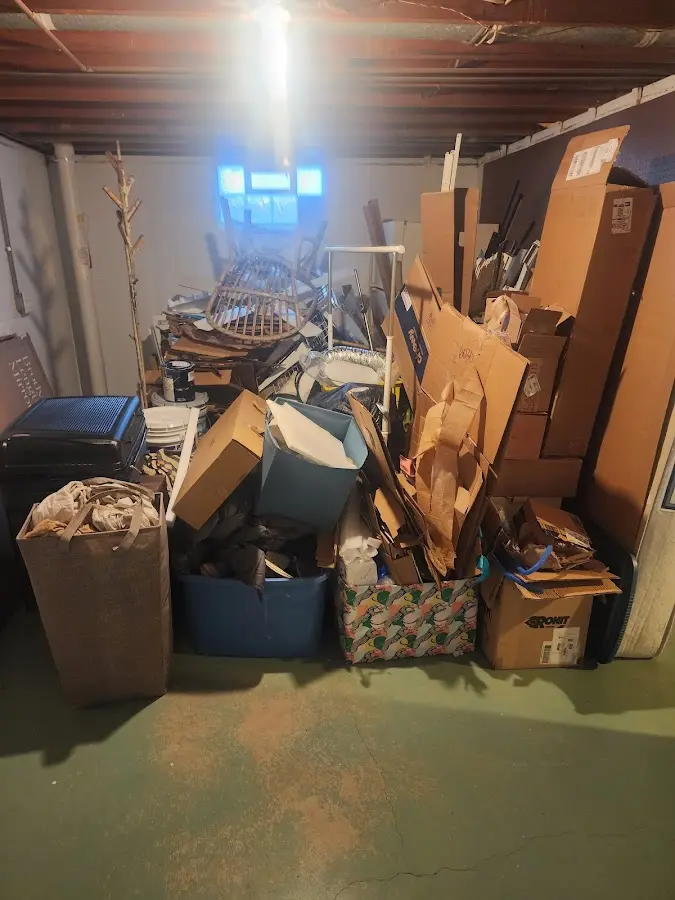 Roll-off dumpster container at job site for Construction Dumpster Rental in Needham